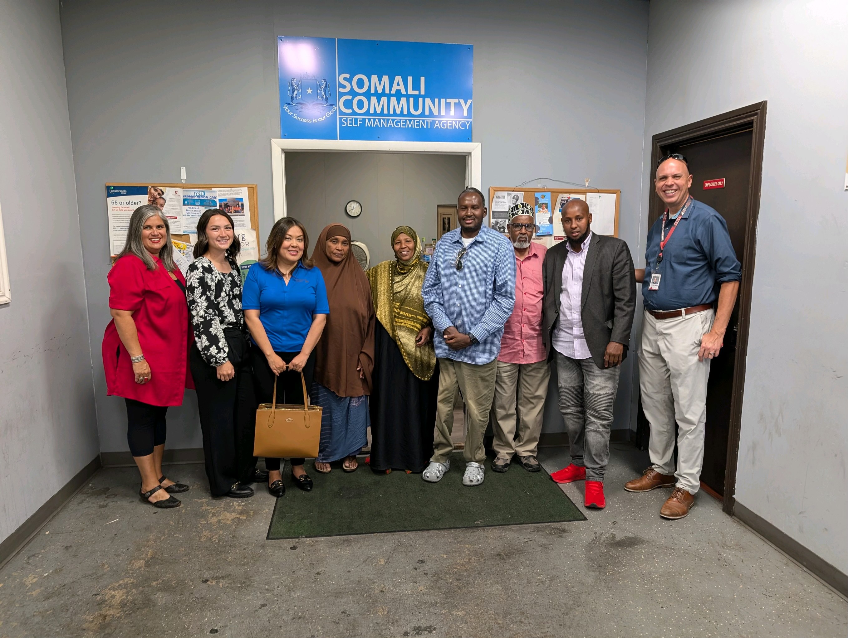 Seniors standing in front of SCSMA office